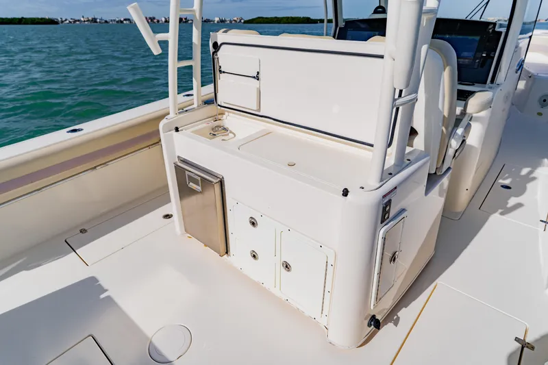 Slide: The Image of 2017 Cobia 344 Center Console boat interior with storage and seating. - 37