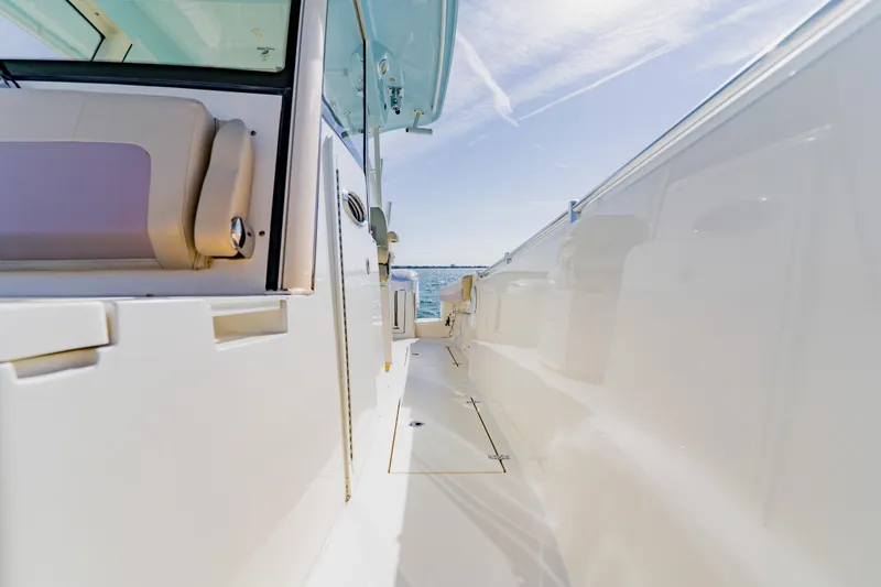 Slide: The Image of 2017 Cobia 344 Center Console boat deck with ocean view. - 38