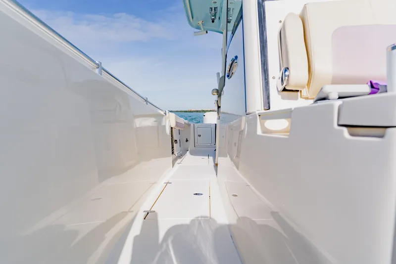 Slide: The Image of 2017 Cobia 344 Center Console boat deck with clear sky and ocean view. - 39