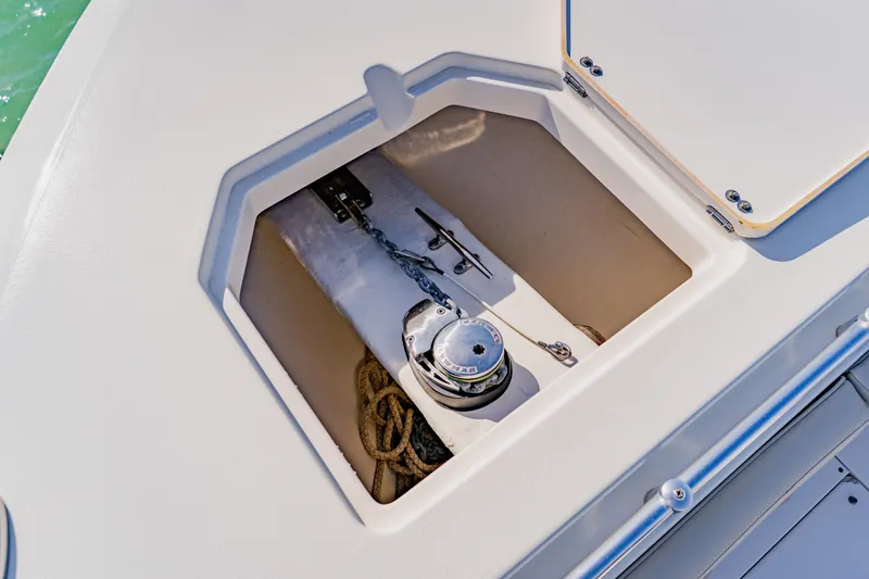 Slide: The Image of 2017 Cobia 344 Center Console anchor locker with chain and rope storage. - 42