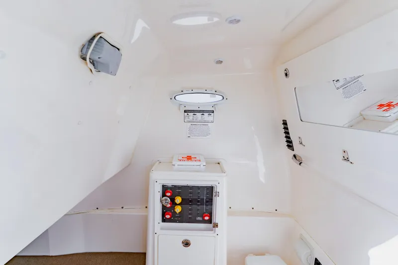 Slide: The Image of 2017 Cobia 344 Center Console interior with control panel and storage compartments. - 47