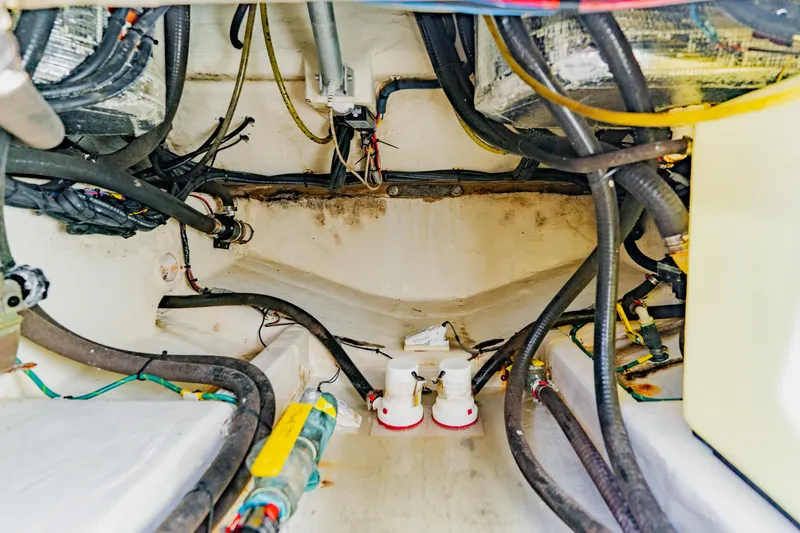 Slide: The Image of 2017 Cobia 344 Center Console boat interior wiring and plumbing system. - 49