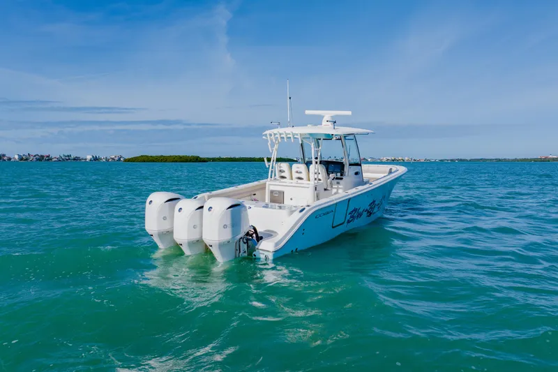 Slide: The Image of 2017 Cobia 344 Center Console boat on clear blue water. - 5