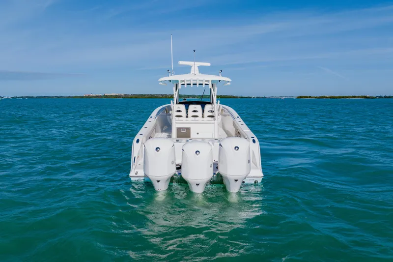 Slide: The Image of 2017 Cobia 344 Center Console boat on open water, rear view. - 7