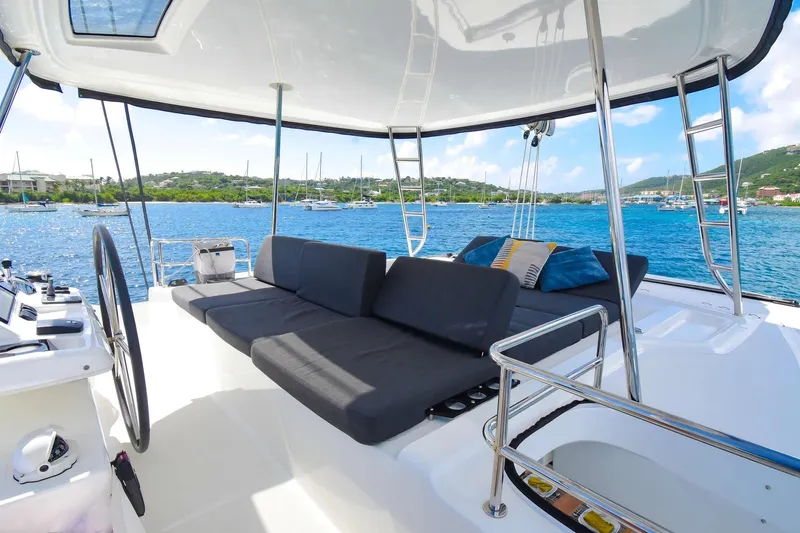 Slide: The Image of Luxurious 2021 Lagoon 50 catamaran with spacious deck and scenic ocean view. - 10