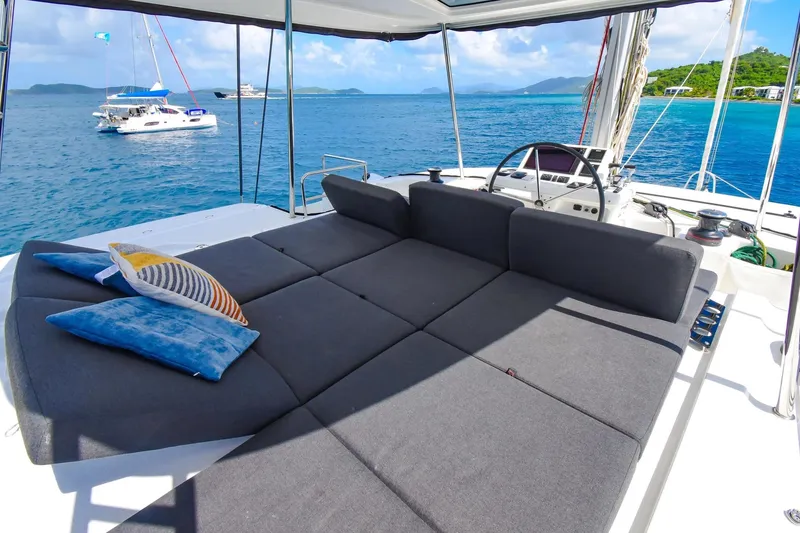 Slide: The Image of Luxurious 2021 Lagoon 50 catamaran with spacious deck lounge and scenic ocean view. - 13