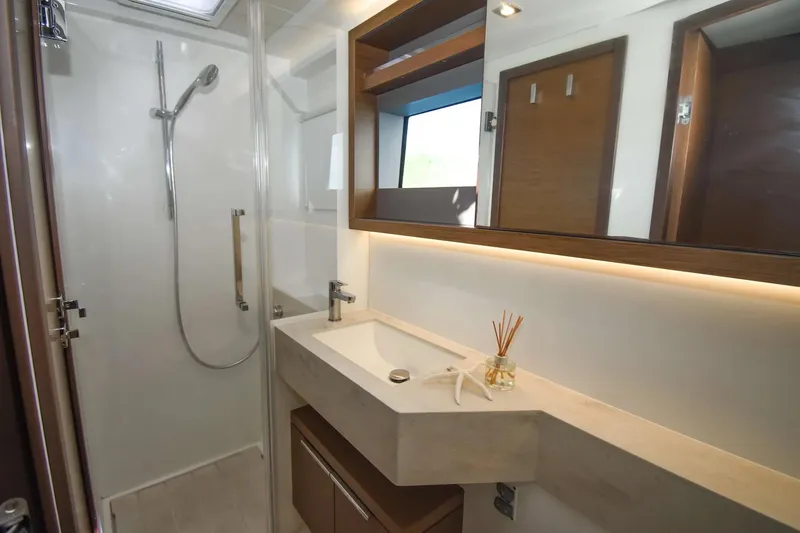 Slide: The Image of Modern bathroom interior on 2021 Lagoon 50 yacht, featuring sleek shower and elegant sink. - 20