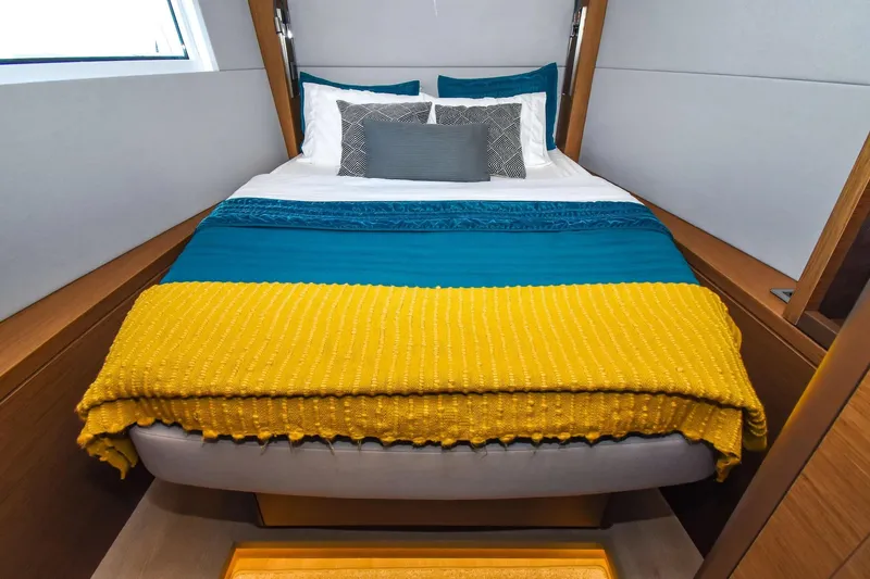 Slide: The Image of Cozy bedroom in 2021 Lagoon 50 yacht with colorful bedding and modern design. - 23