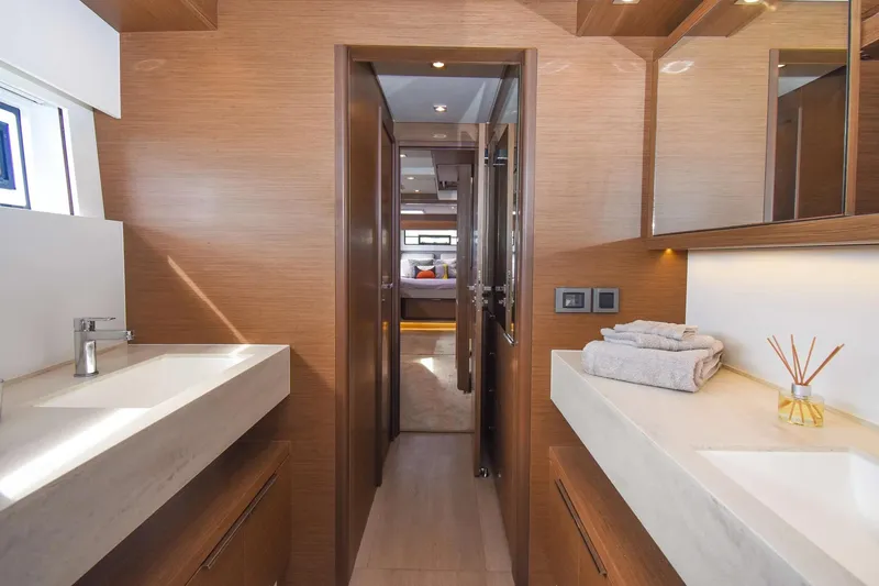 Slide: The Image of Luxurious bathroom interior of 2021 Lagoon 50 yacht with modern fixtures and wooden accents. - 25
