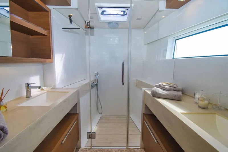 Slide: The Image of Luxurious bathroom interior of 2021 Lagoon 50 yacht with dual sinks and modern shower. - 27