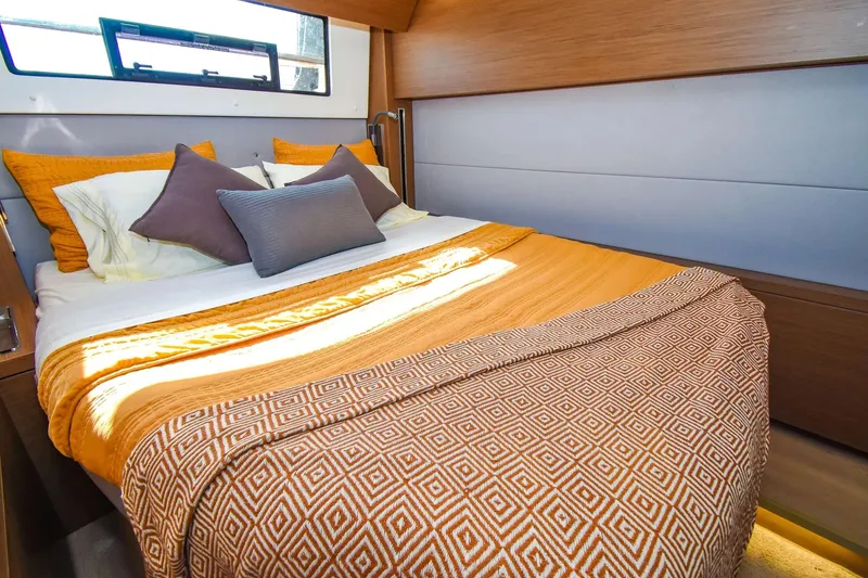 Slide: The Image of Luxurious cabin interior of 2021 Lagoon 50 yacht with cozy bedding and modern design. - 32