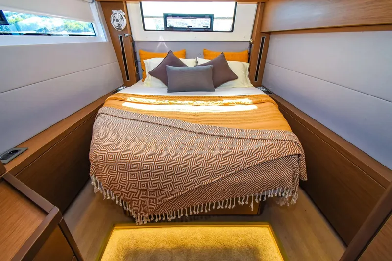Slide: The Image of Luxurious bedroom interior of 2021 Lagoon 50 yacht with cozy bedding and modern design. - 34