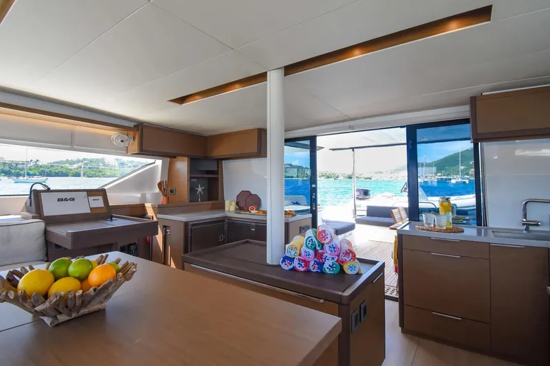 Slide: The Image of Luxurious interior of 2021 Lagoon 50 yacht with modern kitchen and scenic ocean view. - 40