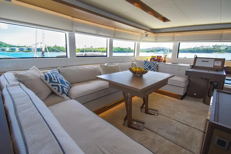 Slide: The Image of Luxurious interior of 2021 Lagoon 50 yacht with spacious seating and scenic windows. - 42