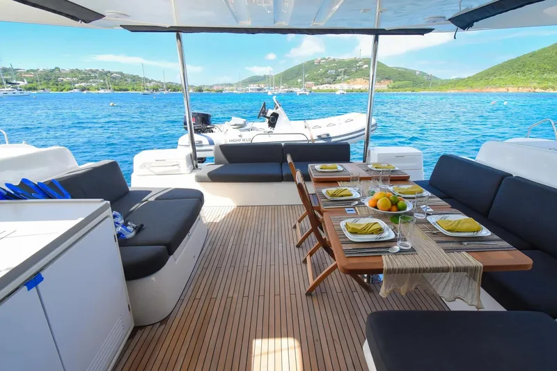 Slide: The Image of Luxurious 2021 Lagoon 50 catamaran with elegant dining setup and scenic ocean view. - 45