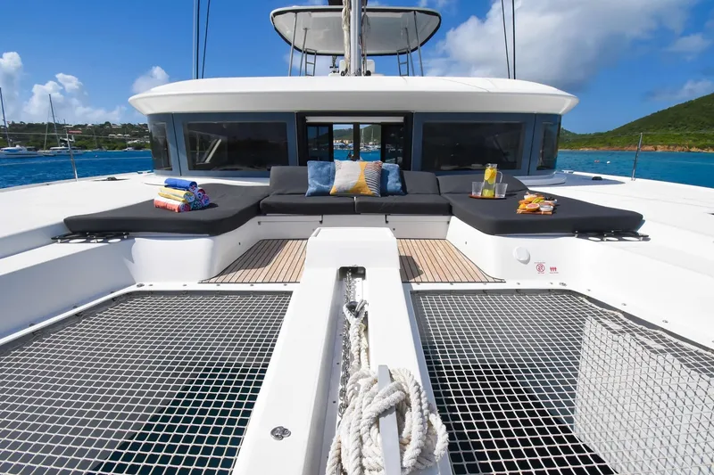 Slide: The Image of Luxurious 2021 Lagoon 50 catamaran with sunbathing area and scenic ocean view. - 5