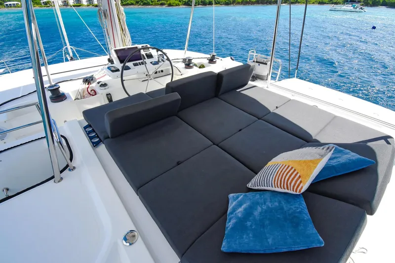 Slide: The Image of Luxurious 2021 Lagoon 50 catamaran deck with plush seating and scenic ocean view. - 7