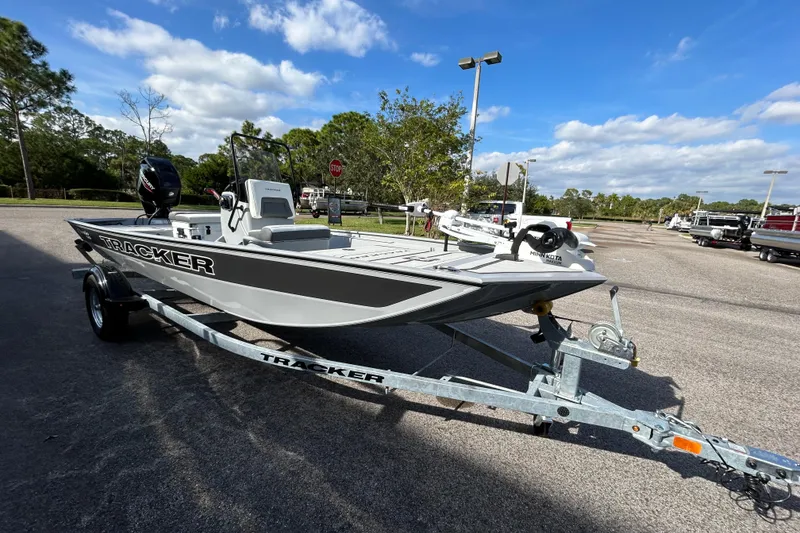 The Image of 2026 Tracker Bass Tracker Classic CC boat on trailer under blue sky. - 0