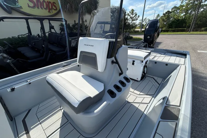 Slide: The Image of 2026 Tracker Bass Tracker Classic CC boat interior with seating and console. - 5