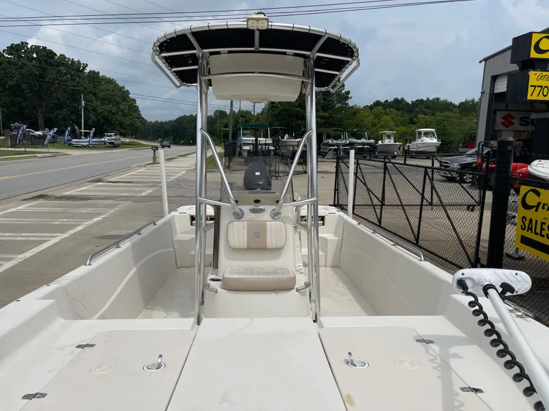 Slide: The Image of 2014 Carolina Skiff 218 DLV boat displayed in parking lot. - 21