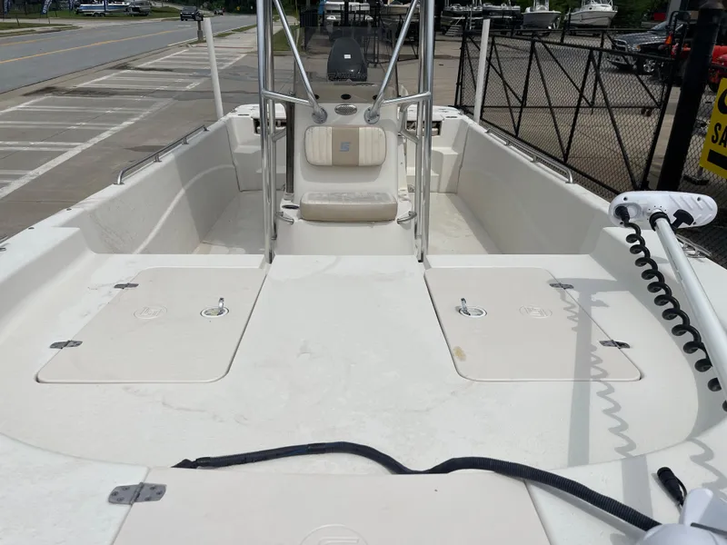 Slide: The Image of Interior view of a 2014 Carolina Skiff 218 DLV boat at dock. - 22
