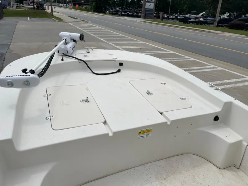 Slide: The Image of 2014 Carolina Skiff 218 DLV boat parked, front deck view. - 24
