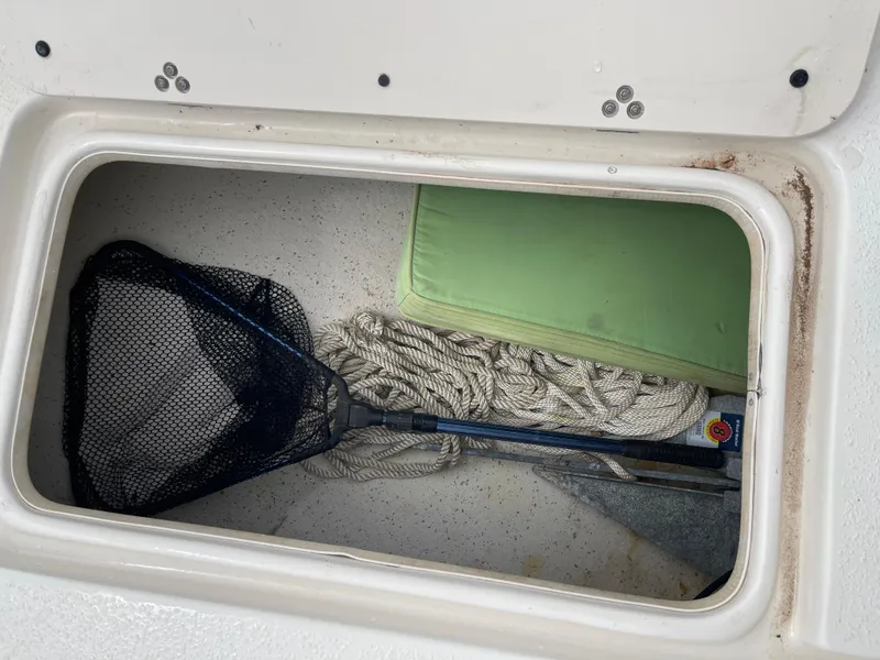 Slide: The Image of Storage compartment in 2014 Carolina Skiff 218 DLV boat. - 26