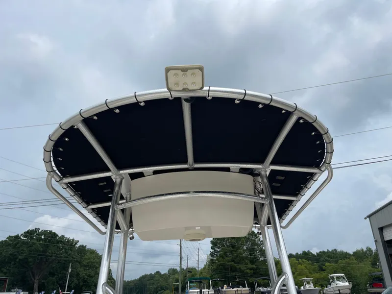 Slide: The Image of 2014 Carolina Skiff 218 DLV with black Bimini top. - 27