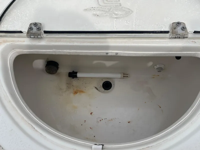 Slide: The Image of Interior view of a 2014 Carolina Skiff 218 DLV storage compartment. - 32