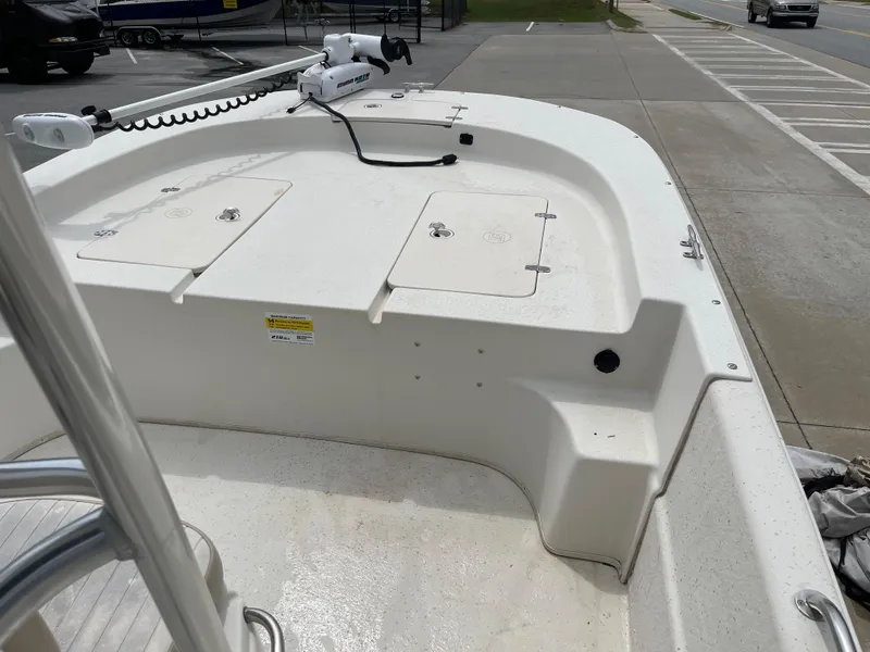 Slide: The Image of 2014 Carolina Skiff 218 DLV boat deck with storage compartments. - 38