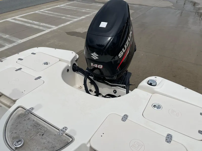 Slide: The Image of 2014 Carolina Skiff 218 DLV with Suzuki 140 outboard motor. - 40