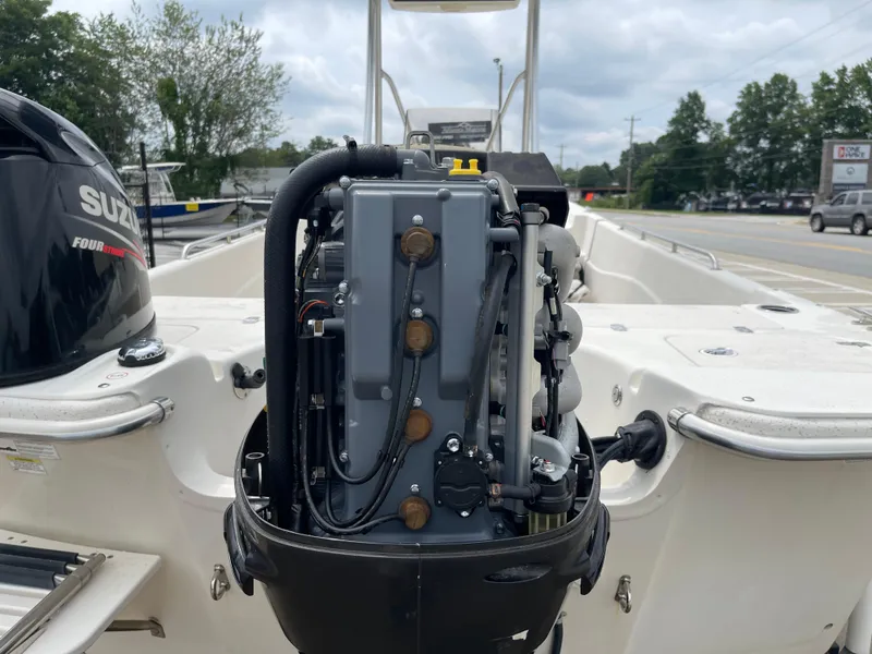 Slide: The Image of Suzuki outboard motor on 2014 Carolina Skiff 218 DLV. - 42