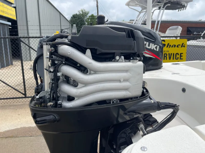 Slide: The Image of Suzuki outboard motor on a 2014 Carolina Skiff 218 DLV. - 43