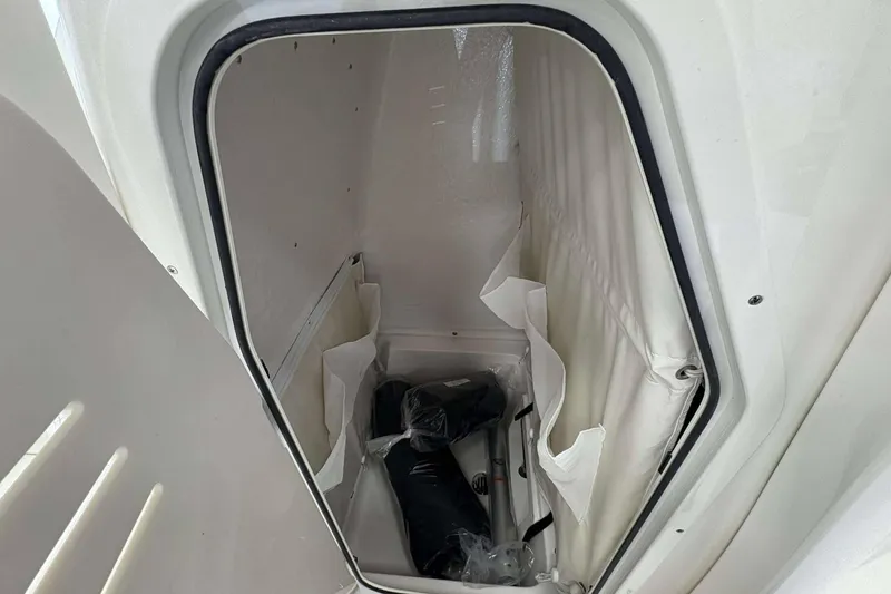 Slide: The Image of Storage compartment inside 2026 Key West 239 FS boat, featuring organized interior space. - 10
