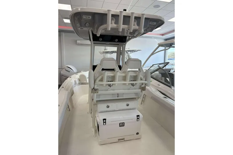 Slide: The Image of 2026 Key West 239 FS boat interior with seating and storage features. - 13