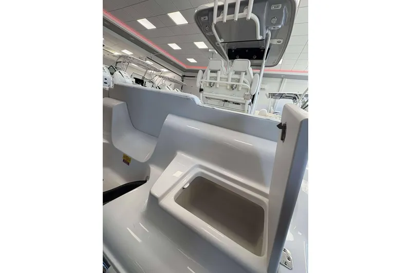 Slide: The Image of 2026 Key West 239 FS boat interior with seating and storage compartments. - 18