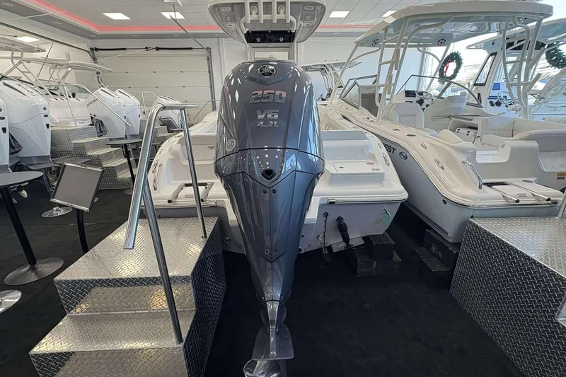 Slide: The Image of 2026 Key West 239 FS boat with powerful V6 engine on display in showroom. - 24