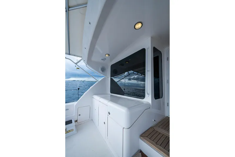 Slide: The Image of 2006 Bertram 630 Convertible yacht deck with ocean view and sleek design. - 18