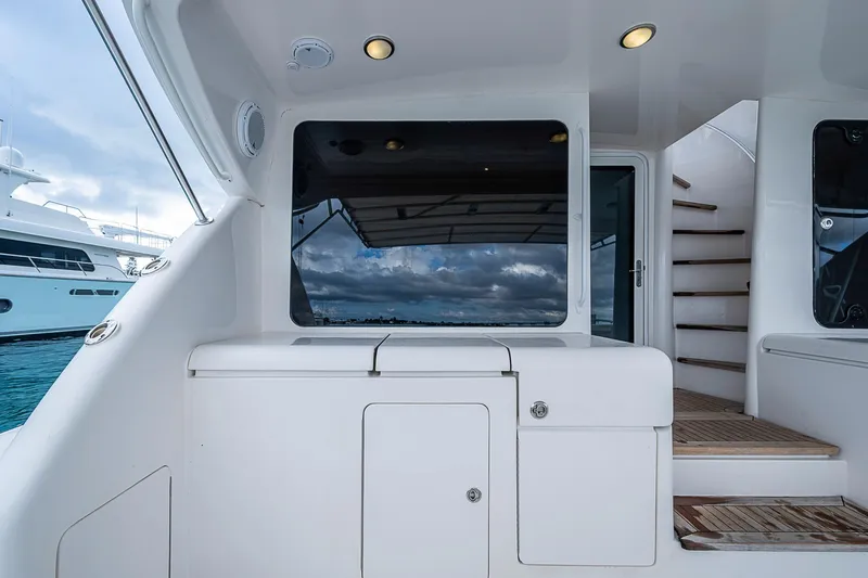 Slide: The Image of 2006 Bertram 630 Convertible yacht interior with sleek design and wooden steps. - 22