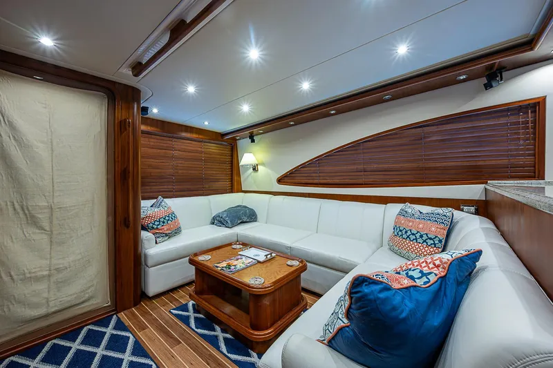 Slide: The Image of Luxurious interior of 2006 Bertram 630 Convertible yacht with plush seating and elegant decor. - 29