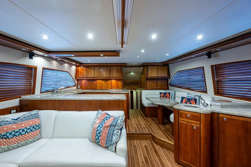 Slide: The Image of Luxurious interior of 2006 Bertram 630 Convertible yacht with wood finishes and modern amenities. - 32