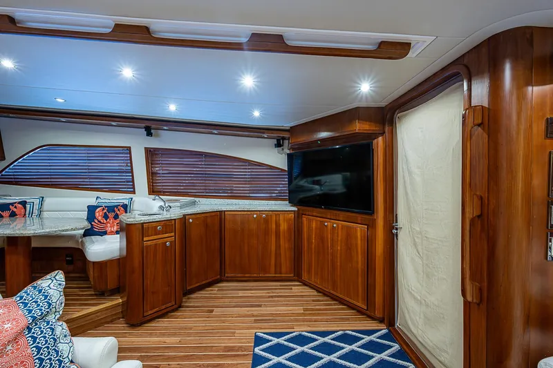 Slide: The Image of Luxurious interior of 2006 Bertram 630 Convertible yacht with wood finishes and modern amenities. - 36