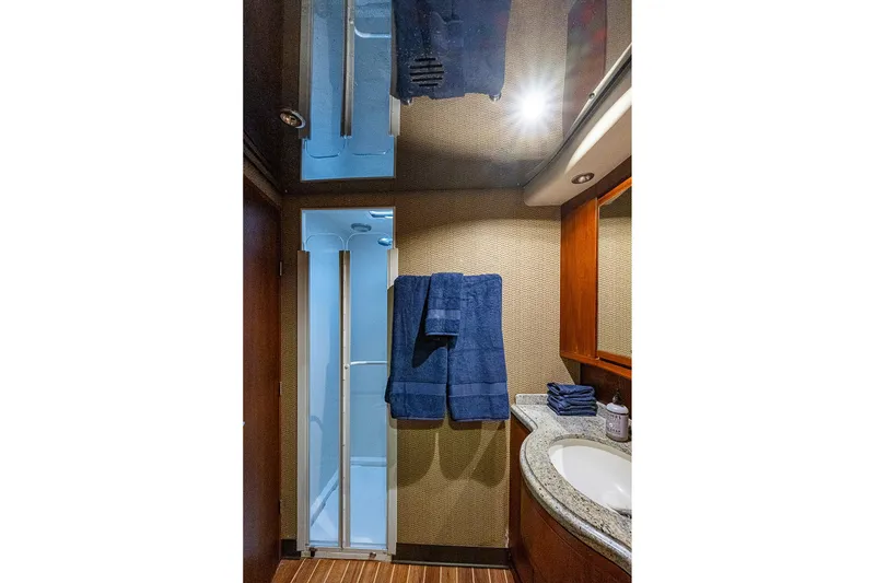 Slide: The Image of Luxurious bathroom interior of 2006 Bertram 630 Convertible yacht with modern amenities. - 45