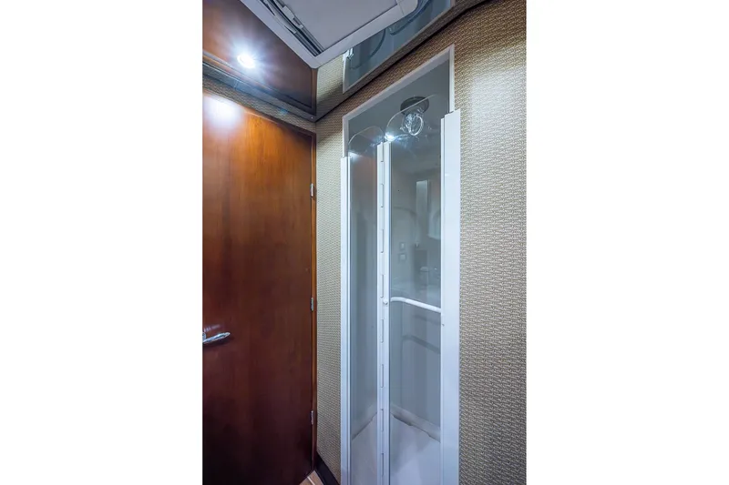 Slide: The Image of Luxurious shower area in 2006 Bertram 630 Convertible yacht interior. - 72