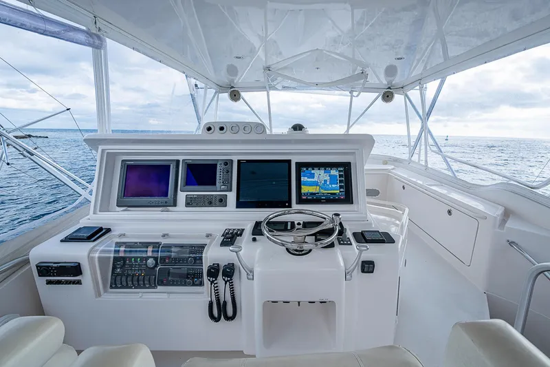 Slide: The Image of Helm of 2006 Bertram 630 Convertible yacht with advanced navigation systems and ocean view. - 76