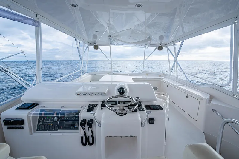 Slide: The Image of Helm of 2006 Bertram 630 Convertible yacht with ocean view. - 81