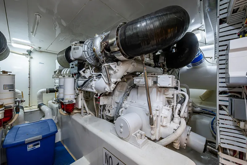 Slide: The Image of Engine room of 2006 Bertram 630 Convertible yacht, showcasing machinery and equipment. - 89