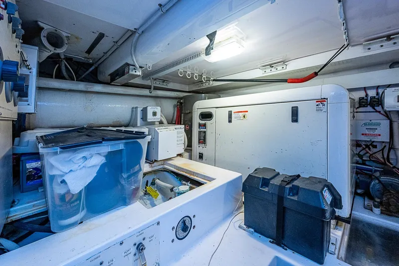 Slide: The Image of Engine room of 2006 Bertram 630 Convertible yacht with equipment and storage. - 91