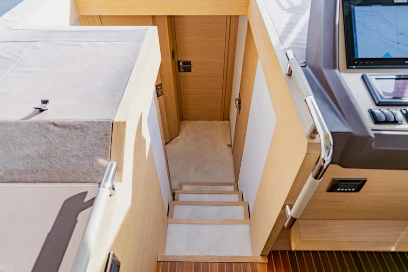 Slide: The Image of Staircase leading to cabin interior on 2015 Monte Carlo MC5 yacht. - 24