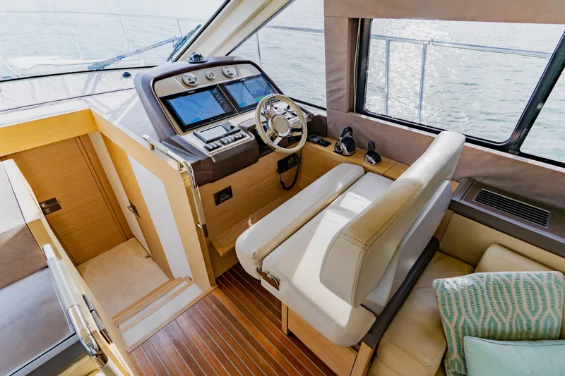 Slide: The Image of Luxurious 2015 Monte Carlo MC5 yacht interior with modern helm and navigation equipment. - 26